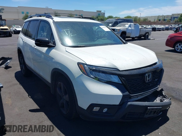 2019 Honda Passport Elite z VIN 5FNYF8H05KB009575, wystawiony jako IAAI lot #42804678 z przebiegiem 70 468 mil mil oraz . Historia ofert i sprzedaży dostępna na DreamBid. Obrazek 1.