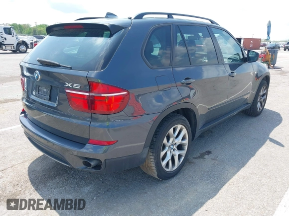 2011 BMW X5 35i with VIN 5UXZV4C57BL739907, listed as a IAAI auction lot 42135572 with 0 mi miles. Bid and sale history available at carsss.com. Image 4.
