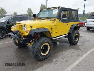 2000 Jeep Wrangler SE with VIN 1J4FA29P5YP705215, listed as a IAAI auction lot 41920532 with 92,927 mi miles and . Bid and sale history available at DreamBid. Image 22.