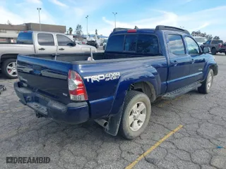 2015 Toyota Tacoma with VIN 3TMMU4FN0FM077148, listed as a IAAI auction lot 41274934 with 112,617 mi miles. Bid and sale history available at carsss.com. Image 4.