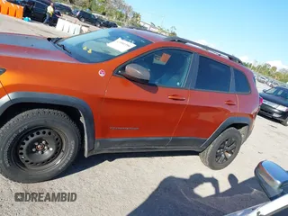 2014 Jeep Cherokee Trailhawk with VIN 1C4PJMBS4EW254879, listed as a IAAI auction lot 41550356 with 101,077 mi miles. Bid and sale history available at carsss.com. Image 15.