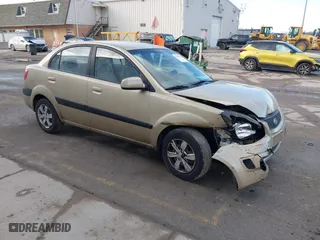 2009 Kia Rio SX with VIN KNADE223196512461, listed as a IAAI auction lot 41520063 with 132,558 mi miles. Bid and sale history available at carsss.com. Image 1.