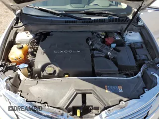 2013 Lincoln MKZ z VIN 3LN6L2GKXDR814615, wystawiony jako Copart lot #65654335 z przebiegiem 100 510 mil mil oraz Szkoda całkowita • Salvage title. Historia ofert i sprzedaży dostępna na DreamBid. Obrazek 11.