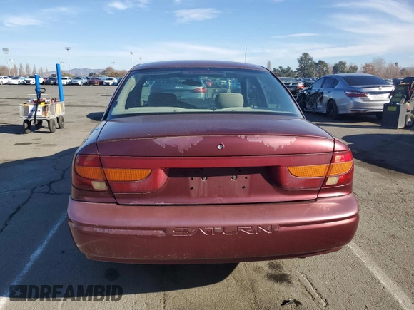 2001 Saturn SL z VIN 1G8ZK54731Z305098, wystawiony jako Copart lot #83875424 z przebiegiem 82 879 mil mil oraz Tytuł czysty. Historia ofert i sprzedaży dostępna na DreamBid. Obrazek 6.