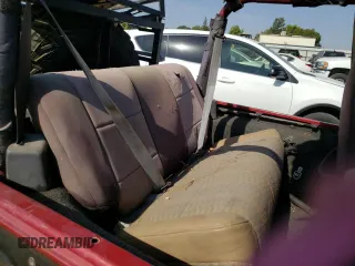 1999 Jeep Wrangler Sport with VIN 1J4FY19S5XP493117, listed as a Copart auction lot 57490792 with Not provided miles and Salvage title. Bid and sale history available at DreamBid. Image 6.