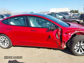 2021 Tesla Model 3 Long Range with VIN 5YJ3E1EBXMF990242, listed as a IAAI auction lot 41674222 with 24,554 mi miles and . Bid and sale history available at DreamBid. Image 13.