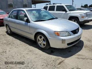 2002 Mazda Protege DX z VIN JM1BJ225920543960, wystawiony jako Copart lot #56336555 z przebiegiem 173 874 mil mil oraz Szkoda całkowita • Salvage title. Historia ofert i sprzedaży dostępna na DreamBid. Obrazek 4.