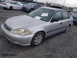 1999 Honda Civic DX with VIN 1HGEJ6628XL028492, listed as a IAAI auction lot 42071358 with 285,769 mi miles. Bid and sale history available at carsss.com. Image 2.