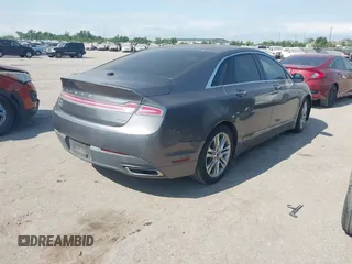 2014 Lincoln MKZ Hybrid z VIN 3LN6L2LU1ER831747, wystawiony jako IAAI lot #42053619 z przebiegiem 137 062 mil mil oraz . Historia ofert i sprzedaży dostępna na DreamBid. Obrazek 4.