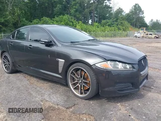 2015 Jaguar XF V6 Portfolio with VIN SAJWA0F74F8U76324, listed as a IAAI auction lot 42158134 with 136,995 mi miles. Bid and sale history available at carsss.com. Image 1.