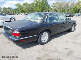 2000 Jaguar XJ with VIN SAJDA14C1YLF04600, listed as a IAAI auction lot 41496106 with 105,000 mi miles. Bid and sale history available at carsss.com. Image 4.