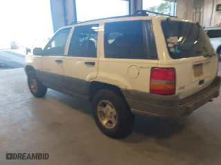 1997 Jeep Grand Cherokee Laredo with VIN 1J4GZ58SXVC552435, listed as a IAAI auction lot 41977888 with 143,832 mi miles. Bid and sale history available at carsss.com. Image 3.