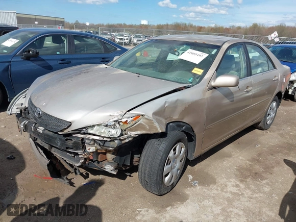 2003 Toyota Camry LE with VIN 4T1BE32KX3U123873, listed as a IAAI auction lot 42085492 with 166,901 mi miles and . Bid and sale history available at DreamBid. Image 2.