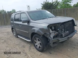 2010 Honda Pilot Touring z VIN 5FNYF4H83AB010432, wystawiony jako IAAI lot #42125885 z przebiegiem 172 516 mil mil oraz . Historia ofert i sprzedaży dostępna na DreamBid. Obrazek 1.