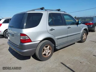 1999 Mercedes-Benz M-Class with VIN 4JGAB54E6XA144914, listed as a IAAI auction lot 42072406 with 125,901 mi miles. Bid and sale history available at carsss.com. Image 4.