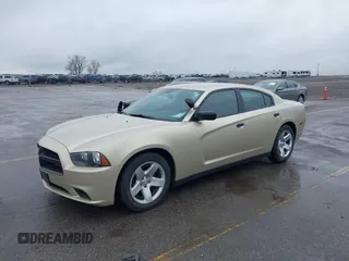 2013 Dodge Charger Police with VIN 2C3CDXAT9DH692946, listed as a IAAI auction lot 42115225 with 107,086 mi miles. Bid and sale history available at carsss.com. Image 2.