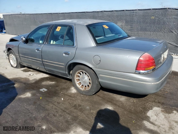 1999 Ford Crown Victoria LX with VIN 2FAFP74W6XX235761, listed as a Copart auction lot 43565595 with 224,979 mi miles and Salvage Title. Bid and sale history available at carsss.com. Image 2.