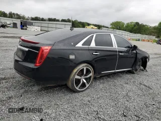 2014 Cadillac XTS Livery z VIN 2G61U5S33E9141464, wystawiony jako Copart lot #52071545 z przebiegiem 231 098 mil mil oraz Tytuł czysty. Historia ofert i sprzedaży dostępna na DreamBid. Obrazek 3.