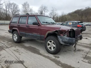 2000 Jeep Cherokee z VIN 1J4FF48S0YL254270, wystawiony jako Copart lot #52589415 z przebiegiem 166 860 mil mil oraz Szkoda całkowita • Salvage title. Historia ofert i sprzedaży dostępna na DreamBid. Obrazek 4.