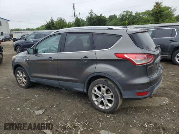 2016 Ford Escape Titanium with VIN 1FMCU9J95GUA58624, listed as a Copart auction lot 59915305 with 102,061 mi miles and Salvage title. Bid and sale history available at DreamBid. Image 2.