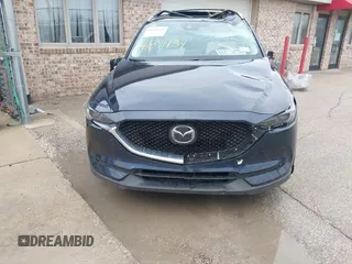 2018 Mazda CX-5 Grand Touring with VIN JM3KFADM1J1439544, listed as a IAAI auction lot 41891134 with 54,132 mi miles and . Bid and sale history available at DreamBid. Image 6.