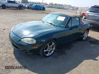 2001 Mazda MX-5 Miata z VIN JM1NB353110214307, wystawiony jako IAAI lot #42407414 z przebiegiem 158 400 mil mil oraz . Historia ofert i sprzedaży dostępna na DreamBid. Obrazek 2.