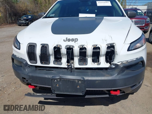 2014 Jeep Cherokee Trailhawk with VIN 1C4PJMBS8EW163212, listed as a IAAI auction lot 42124107 with 114,999 mi miles. Bid and sale history available at carsss.com. Image 6.