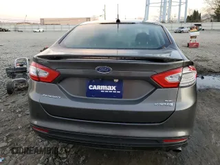 2016 Ford Fusion SE Hybrid with VIN 3FA6P0LU5GR127038, listed as a Copart auction lot 79508174 with 56,555 mi miles and Salvage Title. Bid and sale history available at carsss.com. Image 6.