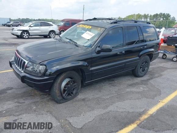 2002 Jeep Grand Cherokee Laredo with VIN 1J4GX48S42C313801, listed as a IAAI auction lot 42297223 with 153,633 mi miles and . Bid and sale history available at DreamBid. Image 2.