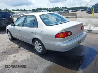 2002 Toyota Corolla CE with VIN 1NXBR12E12Z581660, listed as a IAAI auction lot 42654124 with 115,950 mi miles and . Bid and sale history available at DreamBid. Image 3.