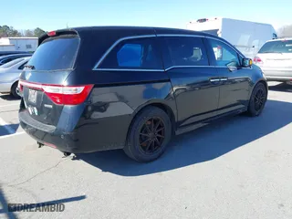 2013 Honda Odyssey Touring with VIN 5FNRL5H99DB076385, listed as a IAAI auction lot 41751504 with 233,875 mi miles. Bid and sale history available at carsss.com. Image 4.