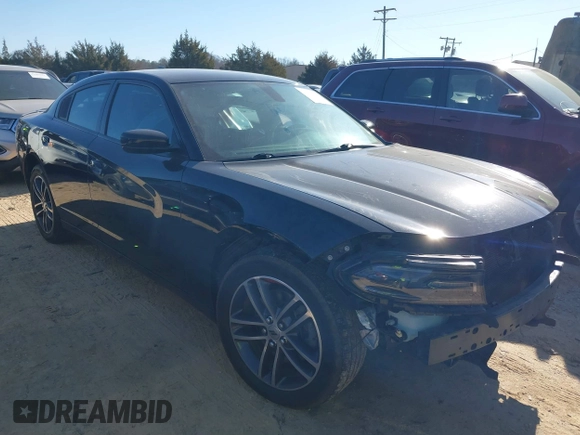 2019 Dodge Charger SXT with VIN 2C3CDXJG4KH710673, listed as a IAAI auction lot 41469797 with 102,011 mi miles and . Bid and sale history available at DreamBid. Image 1.