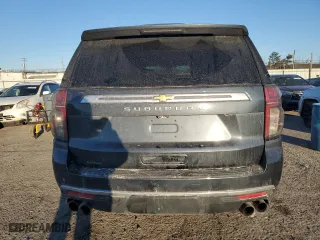 2021 Chevrolet Suburban High Country with VIN 1GNSKGKL0MR100370, listed as a Copart auction lot 42916425 with 100,541 mi miles and Salvage Title. Bid and sale history available at carsss.com. Image 6.