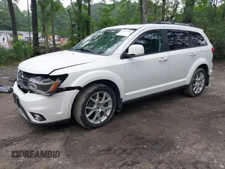 2015 Dodge Journey SXT with VIN 3C4PDCCG2FT690956, listed as a IAAI auction lot 42515701 with 145,676 mi miles and . Bid and sale history available at DreamBid. Image 2.