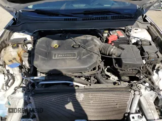 2016 Lincoln MKZ z VIN 3LN6L2G90GR600752, wystawiony jako Copart lot #56599625 z przebiegiem 73 275 mil mil oraz Szkoda całkowita • Salvage title. Historia ofert i sprzedaży dostępna na DreamBid. Obrazek 11.