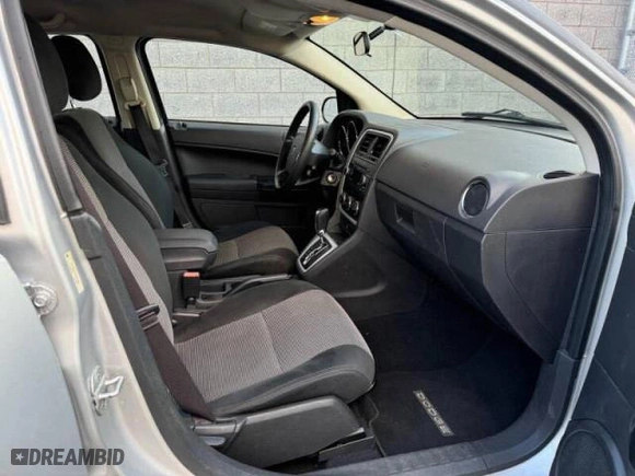 2010 Dodge Caliber SXT with VIN 1B3CB4HA1AD579409, listed as a Copart auction lot 49857695 with 100,311 mi miles and Clean Title. Bid and sale history available at carsss.com. Image 5.