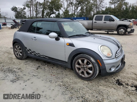 2009 MINI Convertible с VIN WMWMR33579TU95581, выставлен на аукционе Copart как лот 45914735 с пробегом 129 790 миль миль и Списание • Salvage title. История ставок и продаж доступна на DreamBid. Изображение 4.