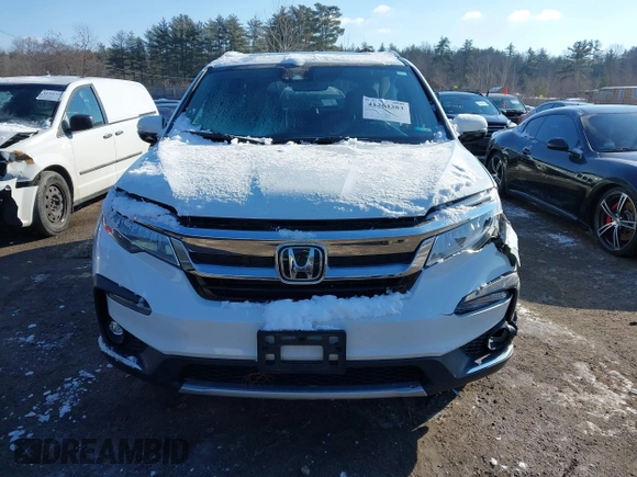 2020 Honda Pilot Elite with VIN 5FNYF6H09LB039247, listed as a IAAI auction lot 41364383 with 56,865 mi miles and . Bid and sale history available at DreamBid. Image 11.