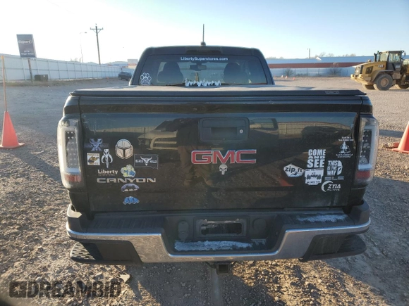 2015 GMC Canyon 4WD SLE with VIN 1GTH6BE37F1133213, listed as a Copart auction lot 82404014 with 142,149 mi miles and Salvage Title. Bid and sale history available at carsss.com. Image 6.