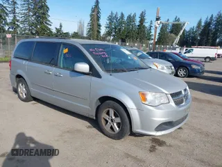2012 Dodge Grand Caravan SXT with VIN 2C4RDGCG0CR329420, listed as a IAAI auction lot 41966560 with 148,755 mi miles and . Bid and sale history available at DreamBid. Image 1.