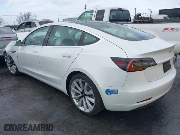 2020 Tesla Model 3 Standard Range Plus with VIN 5YJ3E1EA0LF741311, listed as a IAAI auction lot 41581931 with 43,284 mi miles. Bid and sale history available at carsss.com. Image 3.