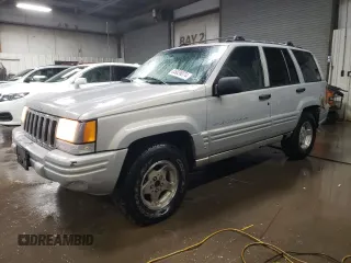1998 Jeep Grand Cherokee Laredo with VIN 1J4GZ48S3WC269693, listed as a Copart auction lot 85026074 with 308,791 mi miles and Salvage Title. Bid and sale history available at carsss.com. Image 1.