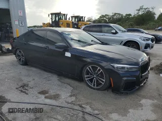 2022 BMW 7 Series 750i xDrive with VIN WBA7U2C01NCK83702, listed as a Copart auction lot 74327704 with Not provided miles and Salvage title. Bid and sale history available at DreamBid. Image 4.