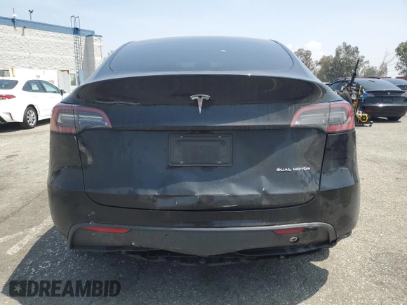 2024 Tesla Model Y Long Range with VIN 7SAYGDEE4RA228916, listed as a Copart auction lot 54921575 with 13,607 mi miles and Salvage title. Bid and sale history available at DreamBid. Image 6.