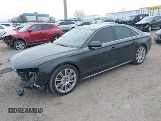 2012 Audi A8 с VIN WAUAVAFD0CN035731, выставлен на аукционе IAAI как лот 41286022 с пробегом 82 835 миль миль и . История ставок и продаж доступна на DreamBid. Изображение 2.