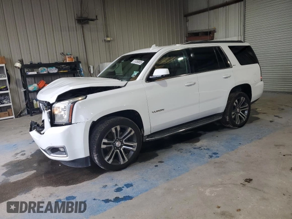 2016 GMC Yukon SLT with VIN 1GKS1BKC5GR450147, listed as a Copart auction lot 51058805 with 163,944 mi miles and Salvage Title. Bid and sale history available at carsss.com. Image 1.