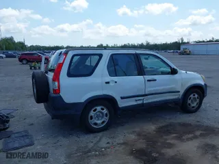 2005 Honda CR-V LX with VIN JHLRD68565C005484, listed as a IAAI auction lot 41983513 with 215,839 mi miles. Bid and sale history available at carsss.com. Image 4.