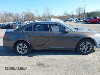 2015 Ford Taurus SEL with VIN 1FAHP2E83FG206055, listed as a IAAI auction lot 41943670 with 90,808 mi miles and . Bid and sale history available at carsss.com. Image 13.