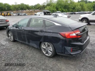 2018 Honda Clarity Touring z VIN JHMZC5F38JC007547, wystawiony jako Copart lot #57199735 z przebiegiem 176 149 mil mil oraz Czysty tytuł • Clean title. Historia ofert i sprzedaży dostępna na DreamBid. Obrazek 2.