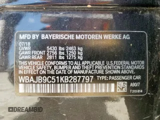 2019 BMW 5 Series M550i xDrive with VIN WBAJB9C51KB287797, listed as a Copart auction lot 65382465 with 61,459 mi miles and Salvage title. Bid and sale history available at DreamBid. Image 12.